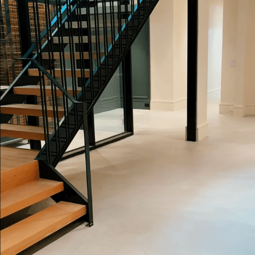 Light burnished microcement floor with smooth modern finish